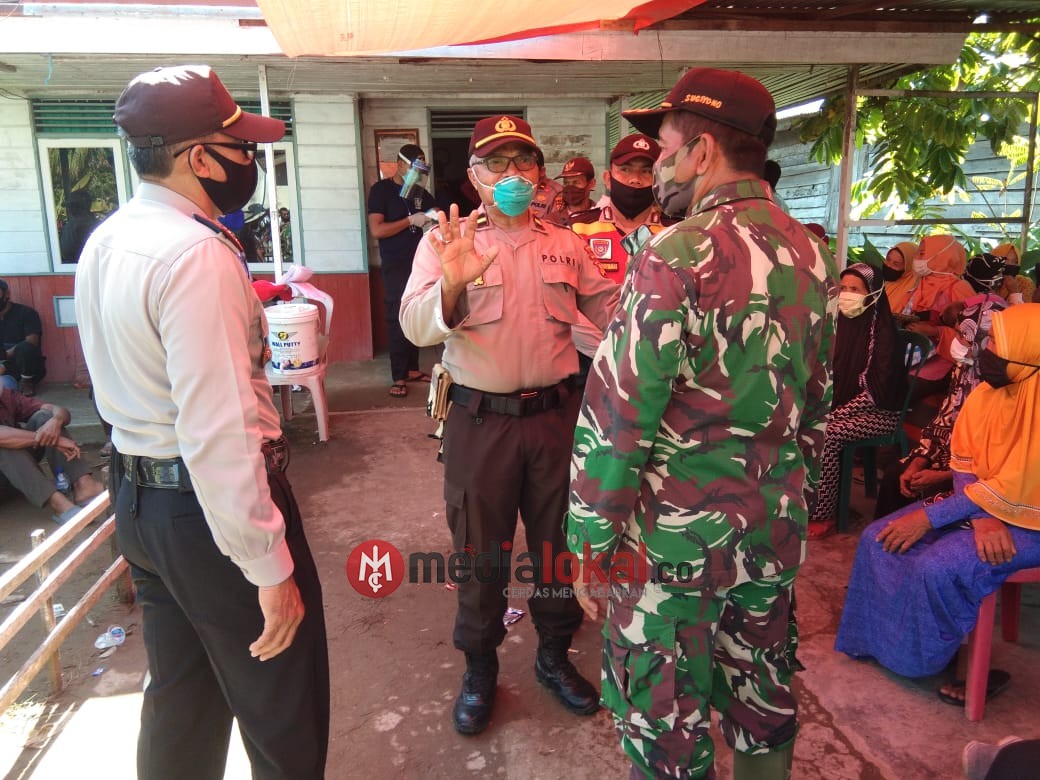 TNI -Polri Serta Aparat Kecamatan Amankan Jalannya Pembagian Dana BST di Kecamatan Tempuling