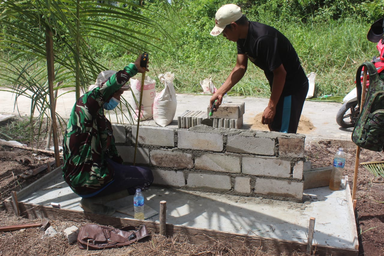 Pembangunan Tugu TMMD di Teluk Bunian Naik Batako