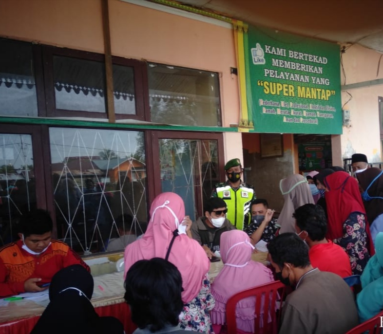 Pelda Zulfahmi Lakukan Pengawalan Penyaluran Bansos di Kuindra