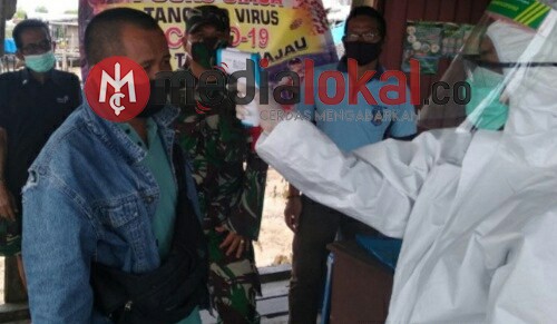 Cegah Covid-19, Koramil 04/Kuindra Lakukan Penegakan Protokol Kesehatan di Tanjung Lajau