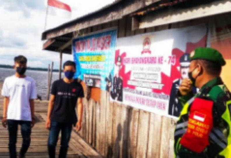 Babinsa Koramil 04/Kuindra Kembali Lakukan Penegakan Protkes di Tanjung Lajau