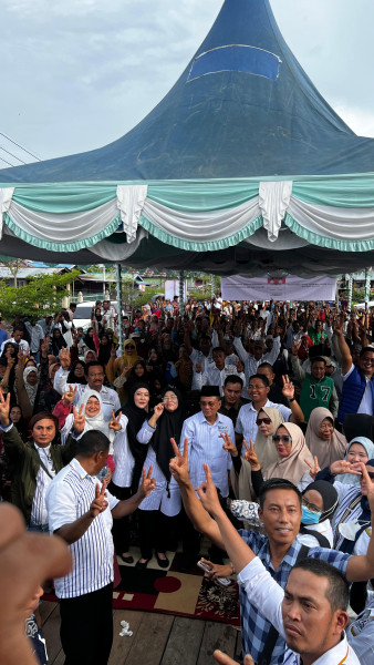 Di Tengah Derasnya Banjir, Kampanye Paslon Bupati Rohil H Bistamam-Jhony Charles Tetap Berjalan