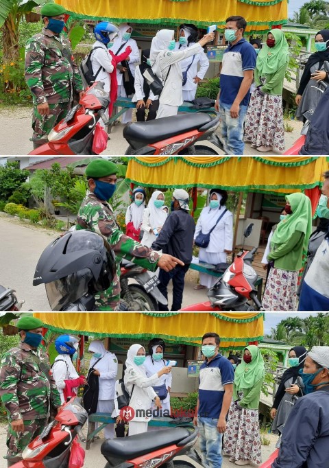 Antisipasi Penularan Covid-19, Babinsa Koramil 12/Batang Tuaka Siaga di Posko Gemilang Jaya