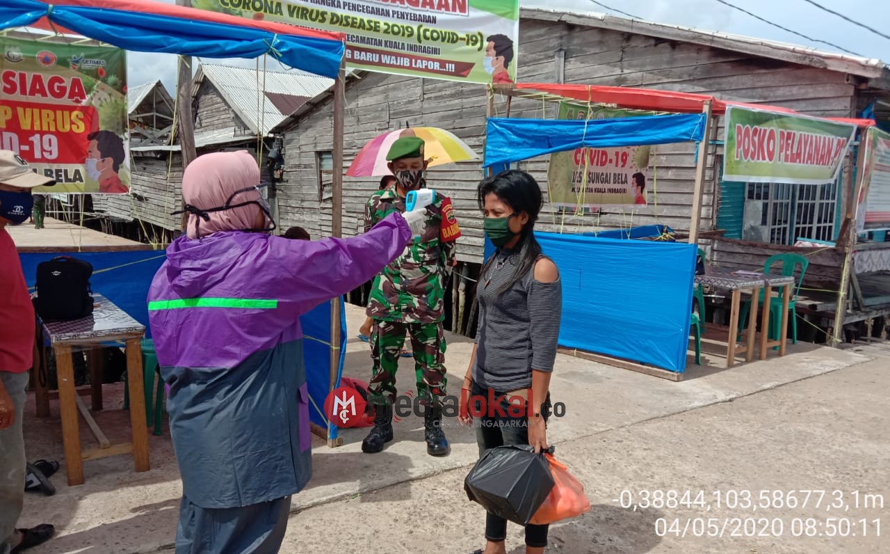 Cegah Covid-19, Babinsa Koramil 04/Kuindra Lakukan Pengawasan di Pelabuhan